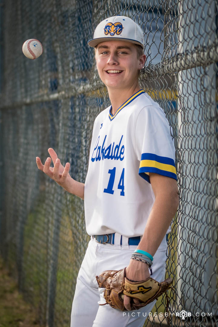 Kartsen senior pics tossing a baseball